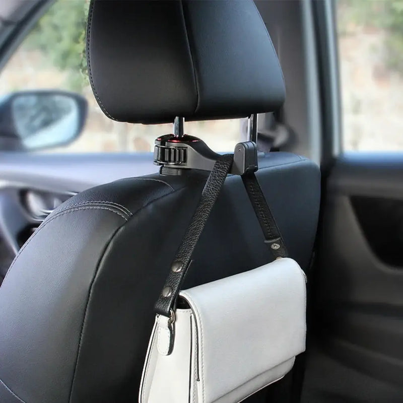 White handbag on a car headrest, showcasing the 360° rotatable phone holder hook