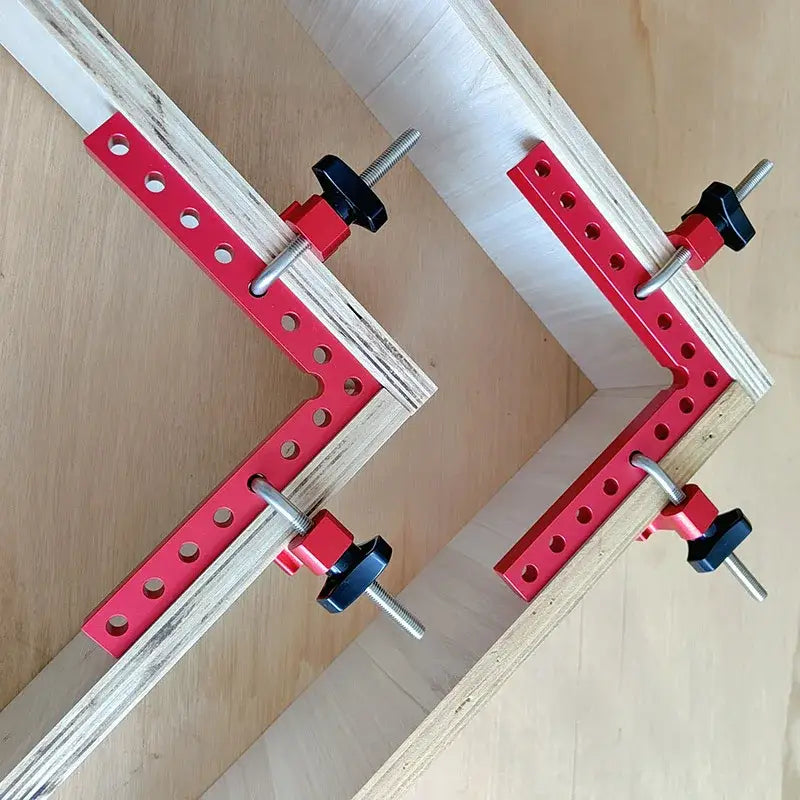 90 Degree Angle Clamp with red metal brackets and adjustable black knobs for precise joints