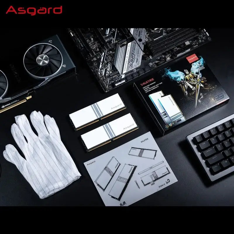 Computer components including Asgard DDR4 RAM, 16GBx2 3200MHz, on dark surface