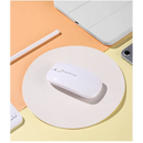 White wireless Bluetooth mouse on a circular surface for seamless comfort and convenience