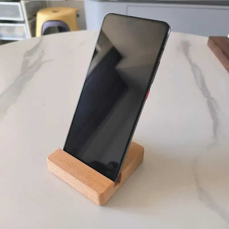 Smartphone on DIXSG Wooden Desk Holder, a stylish wooden desk holder for any brand