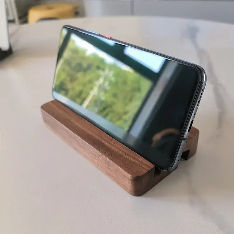 Smartphone on DIXSG Wooden Desk Holder showcasing durable design for universal brands