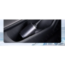 Metallic travel mug in car cup holder beside Handheld Car Vacuum Cleaner