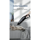 Cordless handheld vacuum cleaner grooming a relaxed cat on a couch at home