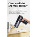 Handheld cordless vacuum cleaner in use on desk, ideal for high power car vacuum needs