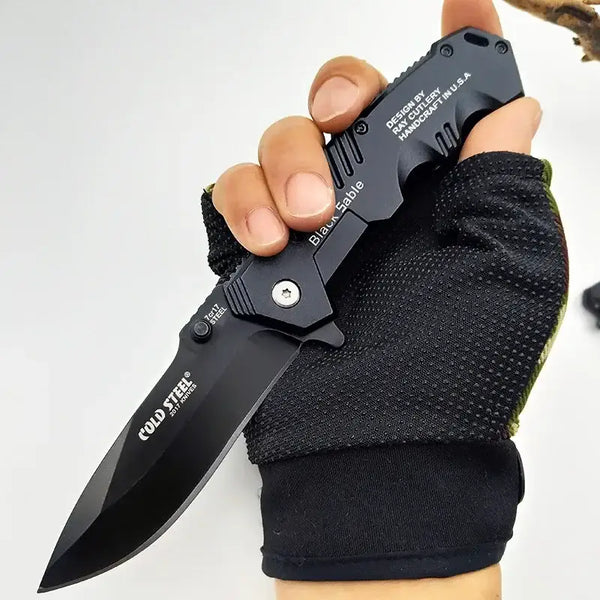 Folding tactical knife in a gloved hand, IROVNE DIY Supplies for precise woodworking