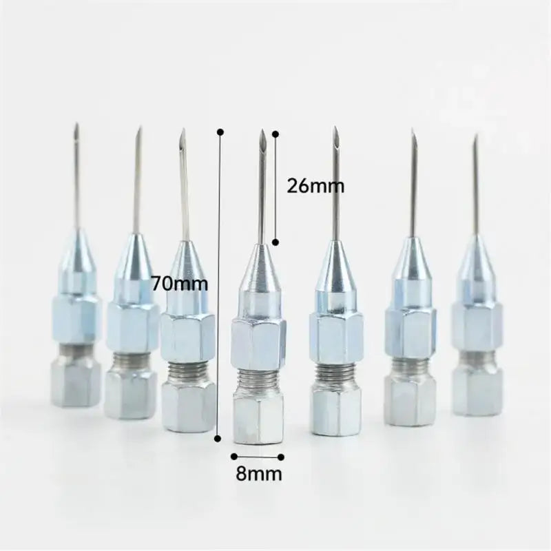 Set of high carbon steel gun needle tips with varying sizes for precise application