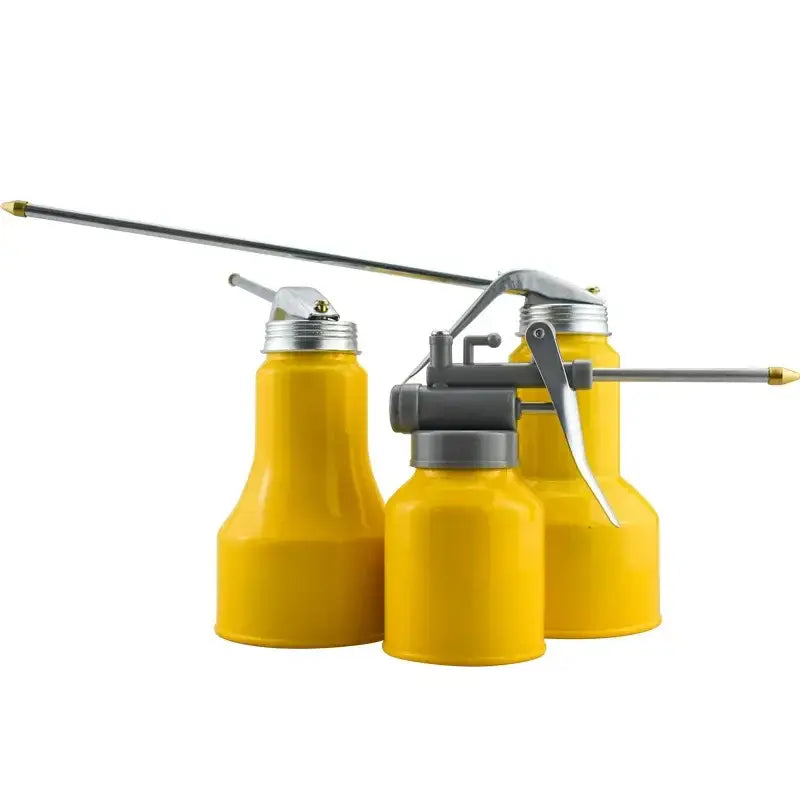 Yellow oil cans with long nozzles, ideal for precise lubrication in car repair tools