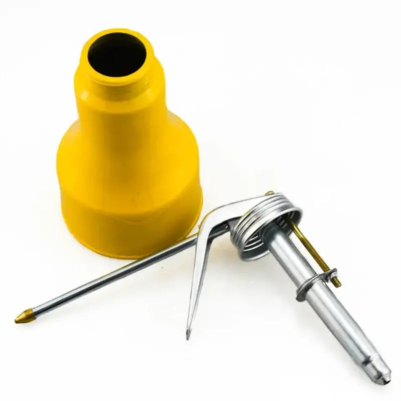 Yellow plastic nozzle next to a metal pointed tool in JustinLau Car Repair Tool Package