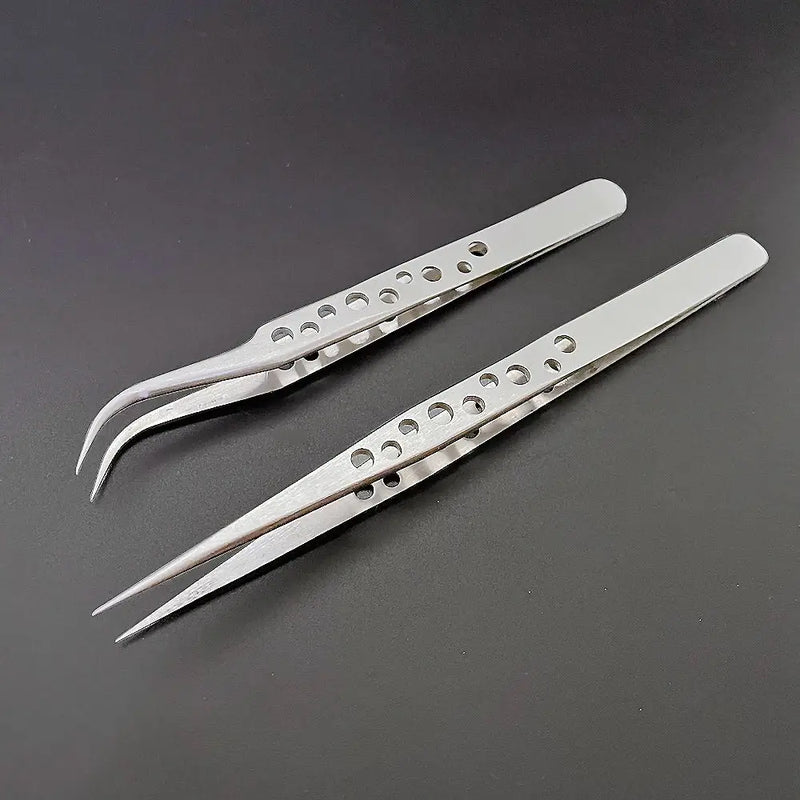 Pair of Lefavor Industrial Tweezers featuring perforated handles for precision tasks