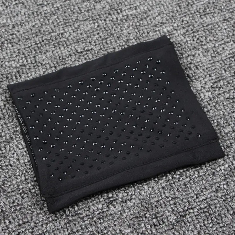 Black fabric wallet featuring a perforated dot pattern from Macroupta Application Position