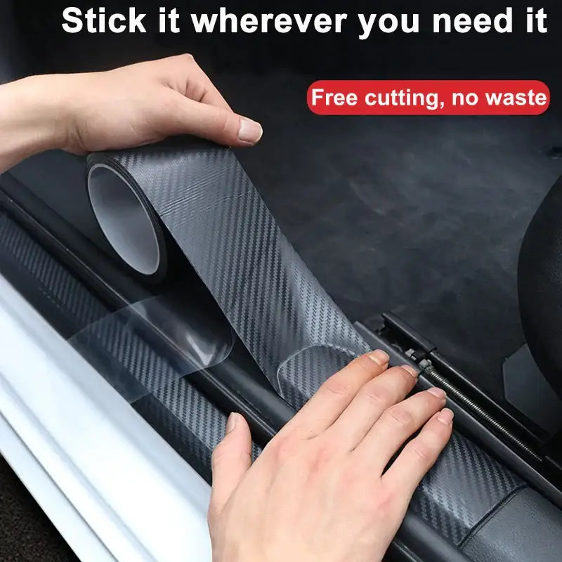 Carbon fiber-textured adhesive film being applied to a car interior with Nano Carbon Fiber