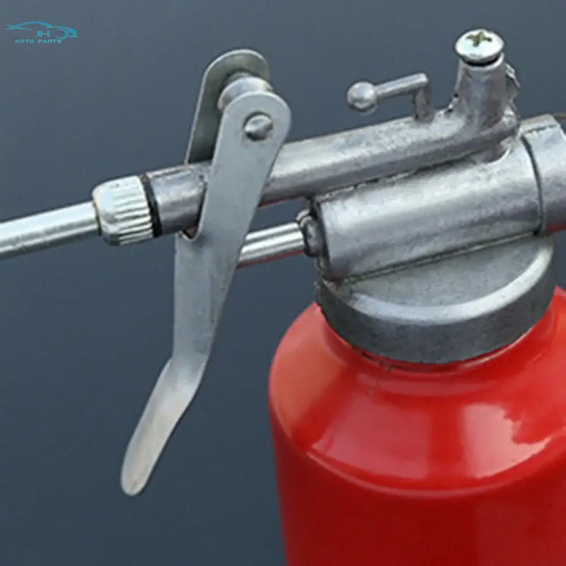 Red metal 250ml oil can with die cast body and long nozzle for precise application