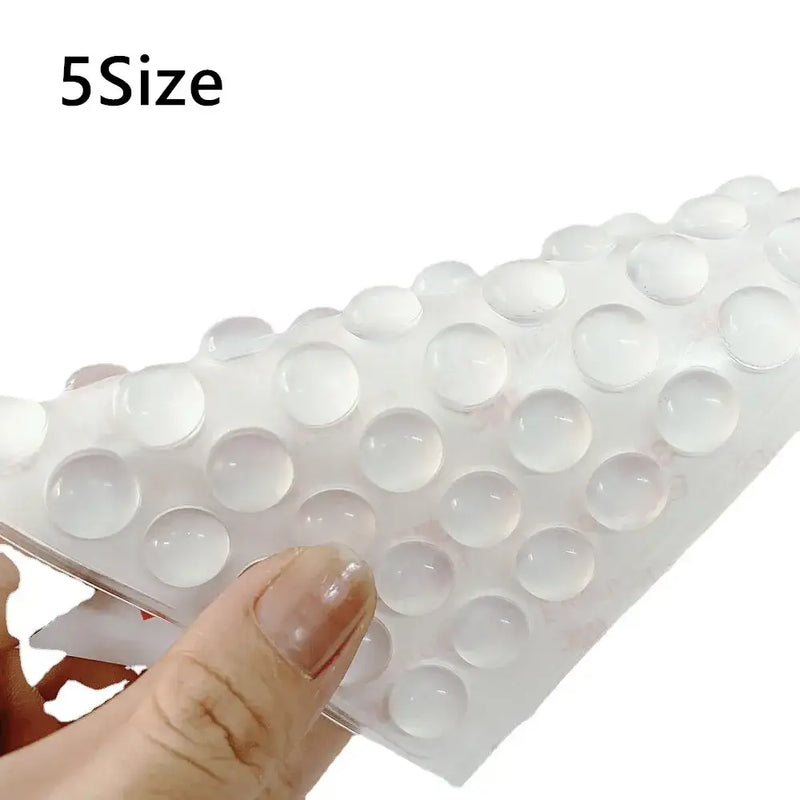 Sheet of clear adhesive dots for NoEnName Null Adhesive Door Stopper display