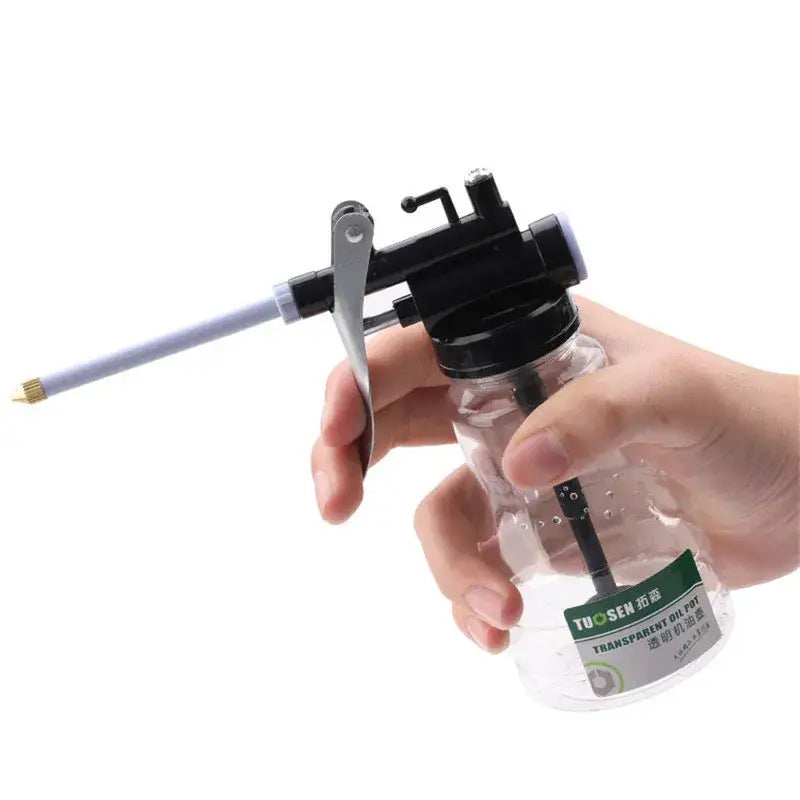 Hand-held pump sprayer with clear bottle and black nozzle in NoEnName Null Origin Engineering Plastic