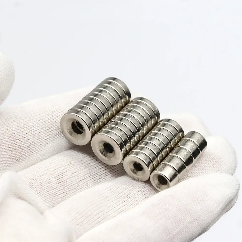 Stacked metallic ring neodymium magnets with central holes for industrial applications