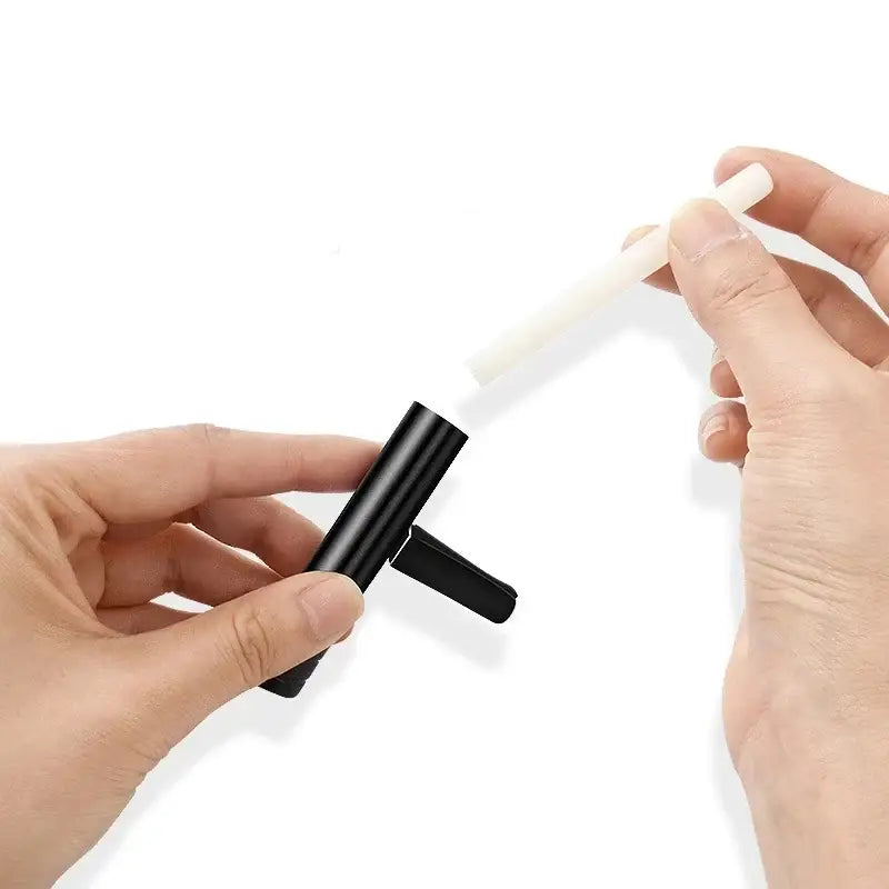 Lint roller with black handle removing debris for use with NoEnName Null Origin Air Freshener