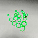 Bright green circular ring gaskets clustered together from NoEnName Null Origin Ring Gasket