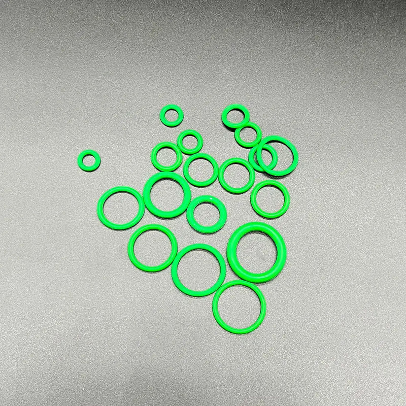 Bright green circular ring gaskets clustered together from NoEnName Null Origin Ring Gasket