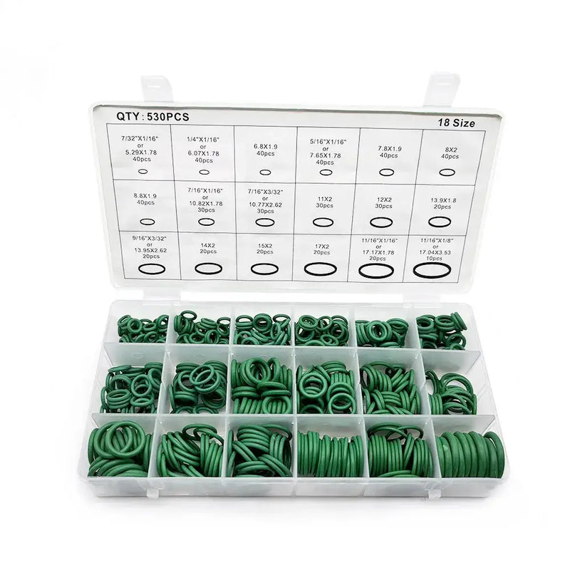 Plastic organizer box containing assorted green rubber O-rings and origin ring gaskets