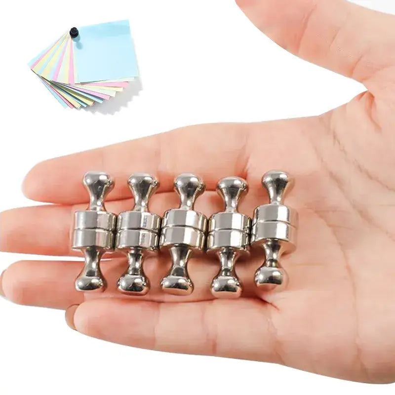 Five metallic push pins with neodymium magnets showcasing magnetic strength on a palm