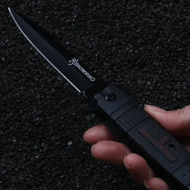 Black folding knife with curved blade held open, part of NoEnName_Null Stainless Steel Metalworking Tool