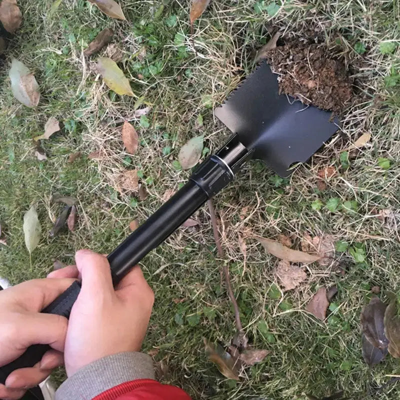 Folding shovel made of alloy steel for garden tool parts on grass and leaves