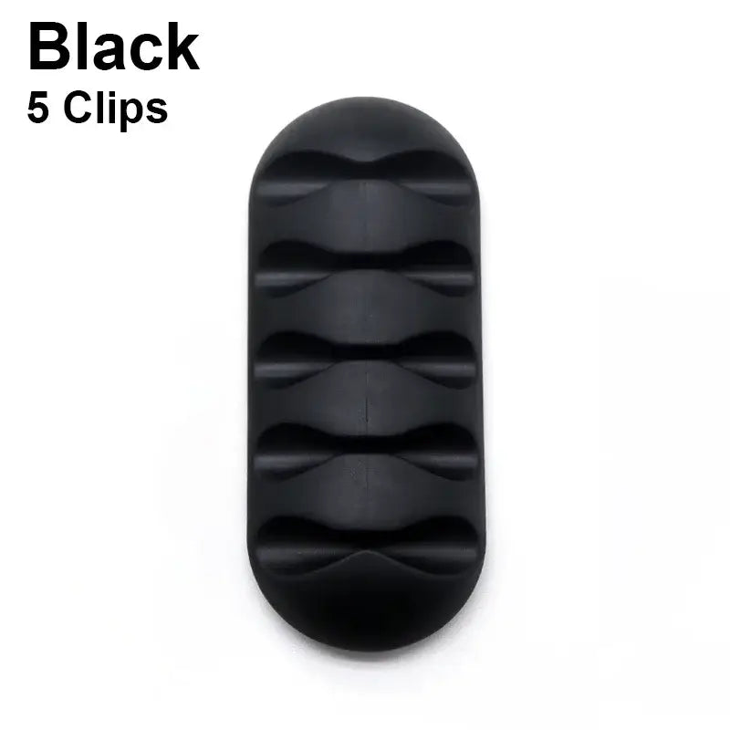 Black oval silicone USB cable manager with five ridges for organizing cables