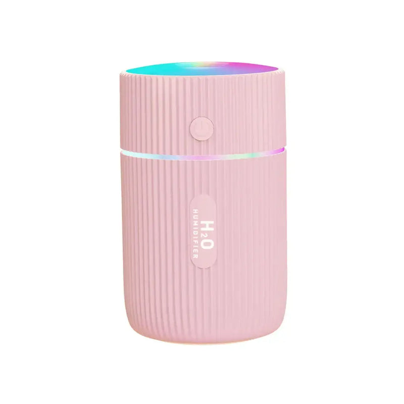 Pink cylindrical air humidifier with glowing top for car air and enhanced humidifier feature