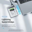 Transparent Orico Mainland China Case for 6TB hard drive connected to laptop via USB