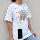 White t-shirt featuring colorful cartoon graphics and star designs with adjustable detachable cord