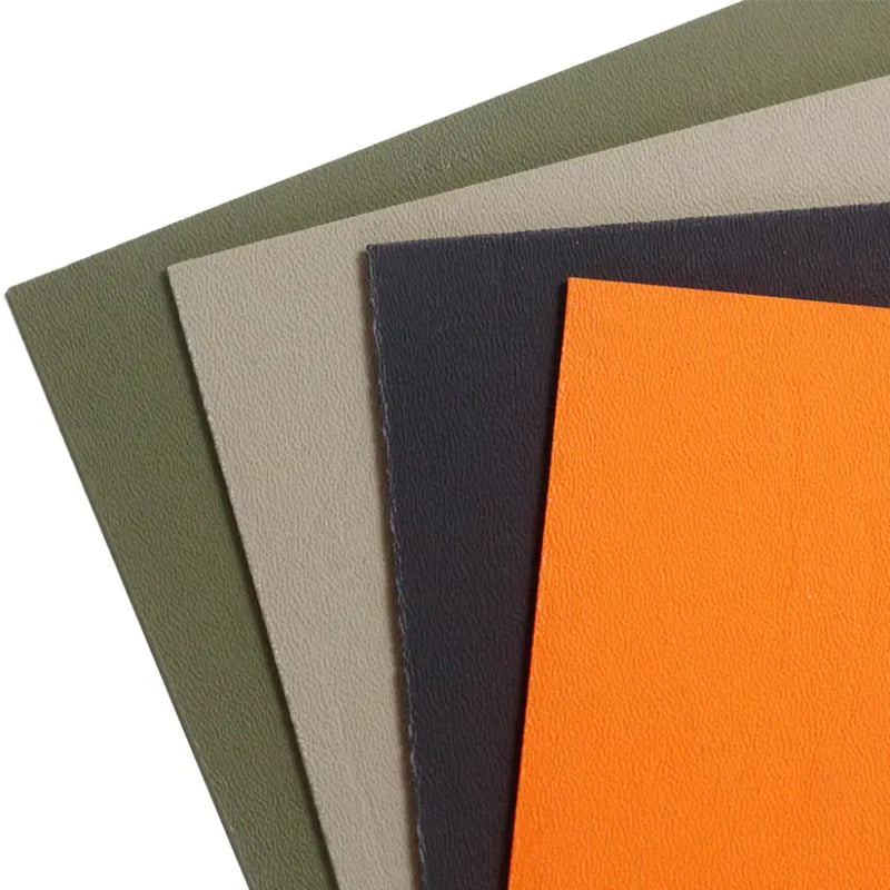 Stack of colored fabric sheets in olive green, beige, navy blue, and bright orange by QingGear Commercial Manufacture