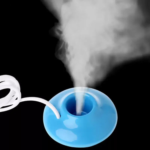 Blue donut-shaped humidifier showcasing the Robovacs humidification method with vapor