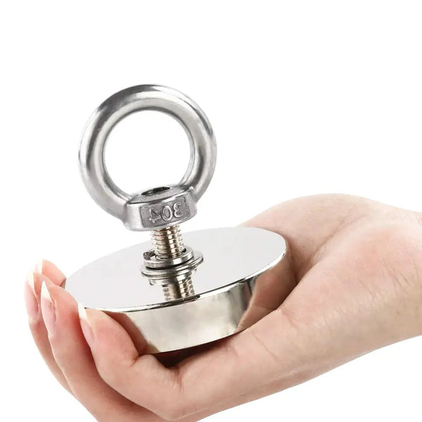 Hand holding a strong Neodymium Industrial Magnet with an attached eyebolt for versatile use