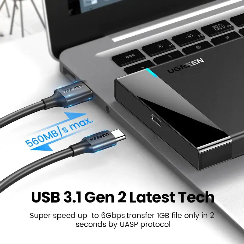 USB cable connected to a laptop showcasing UGREEN HDD Case for fast data transfer speeds