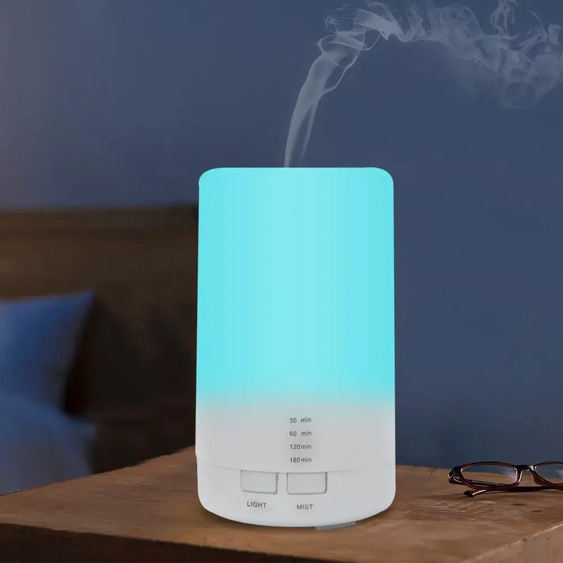 Cylindrical USB Aroma Diffuser emitting vapor, enhancing air quality with essential oils