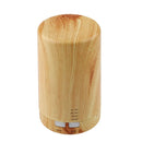 Cylindrical wooden USB aroma diffuser enhances air quality with essential oils