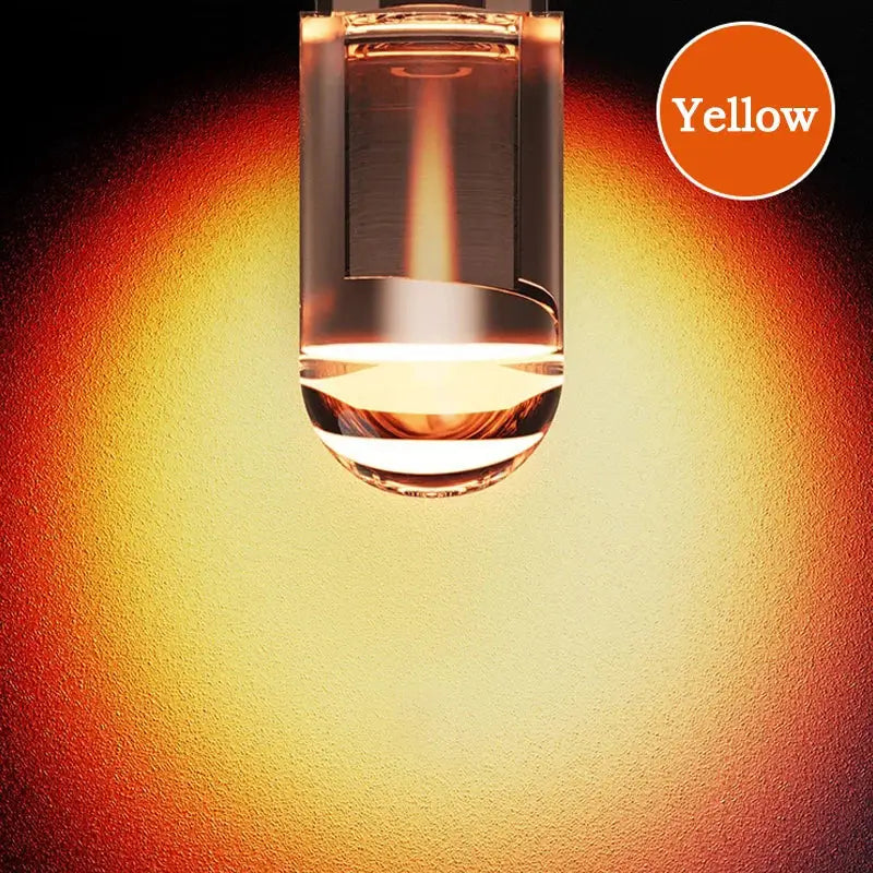 W5W LED T10 car light with COB glass technology emitting a warm yellow glow