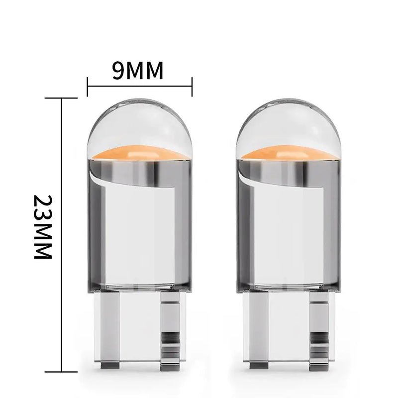 Cylindrical W5W LED T10 car light pods with transparent tops and metallic bases