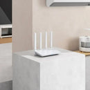 White Xiaomi AX3000T Router with four antennas for stable Wi-Fi connections