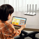 Child using a tablet with educational app supported by Xiaomi AX3000T Router for stable Wi-Fi